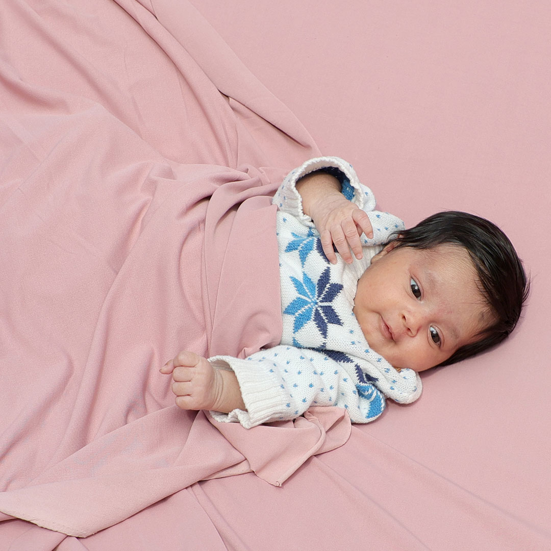 Newborn baby photoshoot in Ranchi on a pink wrap